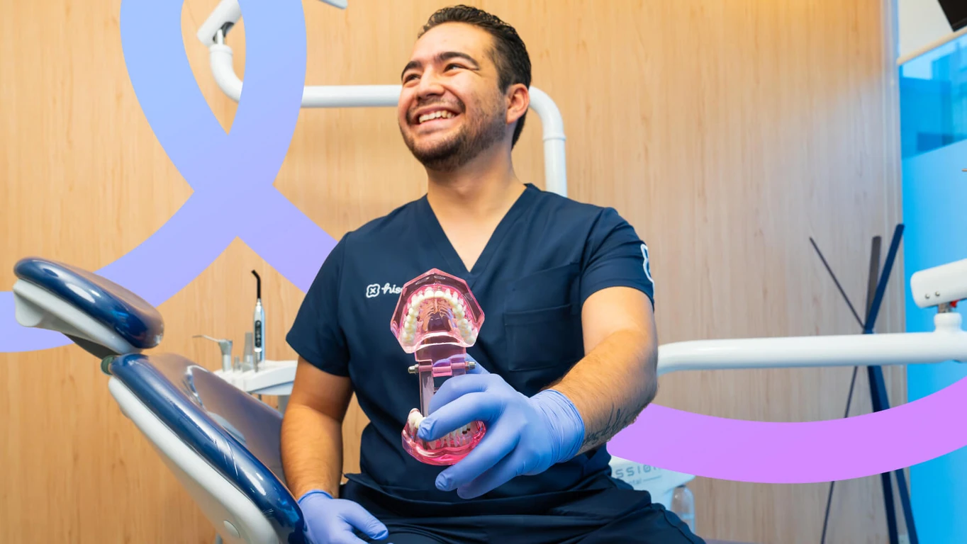 Mexico City dentist showing a removable partial denture to a patient.