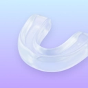 Night guard icon with a protective dental appliance.