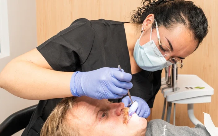 Dentist caring for a patient during treatment at hisonrisa.