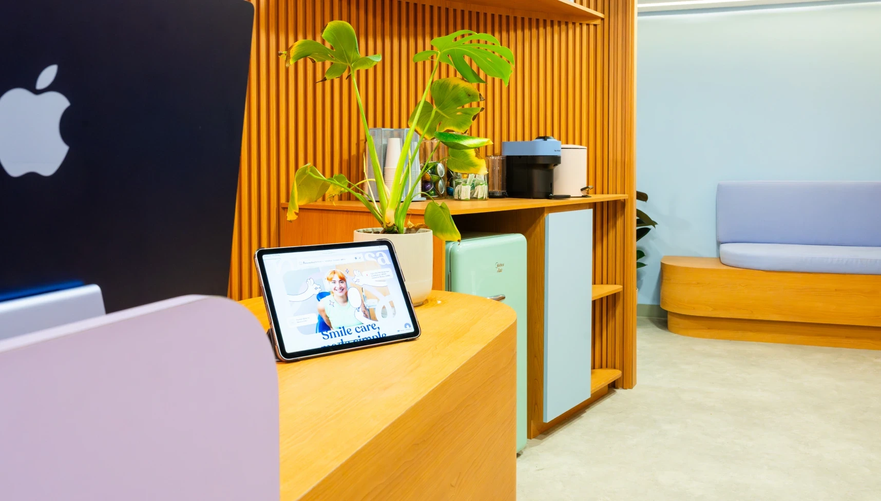 Relaxed reception area at hisonrisa with warm wood finishes and patient lounge seating.